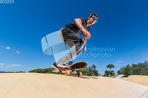 Image of Skateboarder on a pump track park