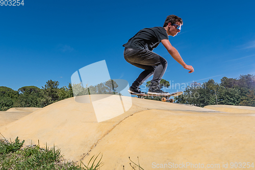 Image of Skateboarder on a pump track park