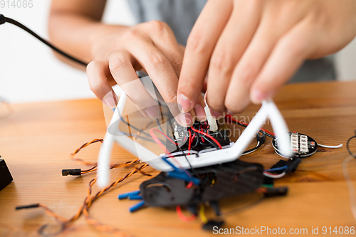 Image of Connecting the wire of flying drone