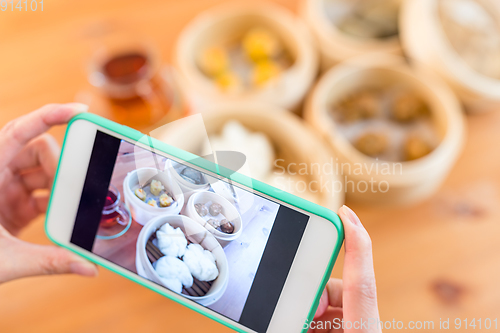 Image of Taking photo on dim sum 