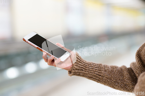 Image of Woman use of mobile phone