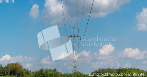 Image of cloudy morning sky and a high-voltage line