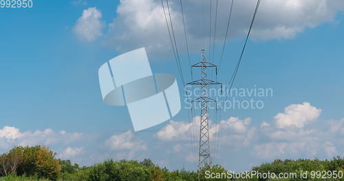 Image of cloudy morning sky and a high-voltage line