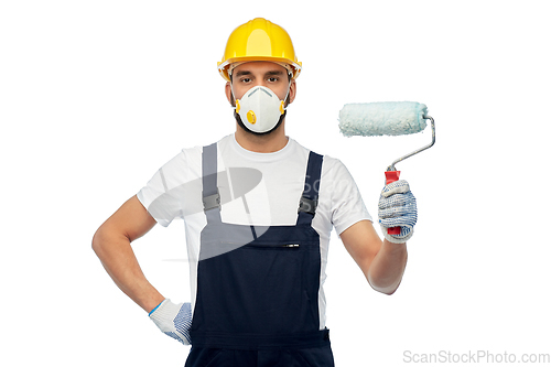 Image of worker or builder in respirator with paint roller