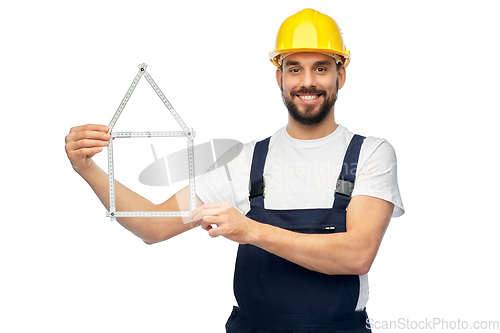 Image of happy male worker or builder with carpenter's rule