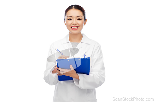 Image of happy smiling asian female doctor with clipboard