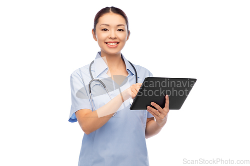 Image of asian female nurse with tablet pc and stethoscope