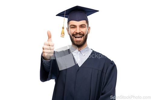 Image of happy male graduate student showing thumbs up