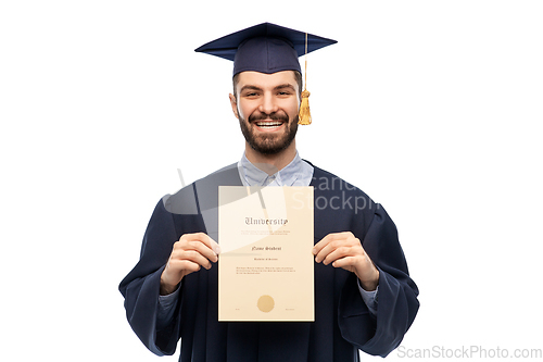 Image of male graduate student in mortar board with diploma