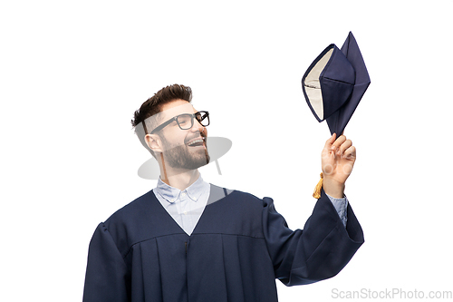 Image of graduate student in bachelor gown with mortarboard