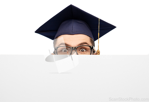 Image of graduate student or bachelor behind white board