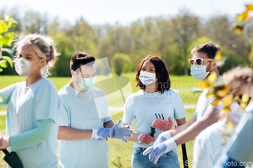 Image of group of volunteers planting tree in park