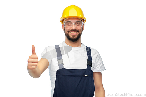 Image of happy male worker or builder showing thumbs up