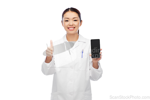 Image of asian doctor with smartphone shows thumbs up