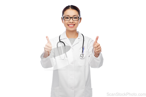 Image of smiling asian female doctor showing thumbs up