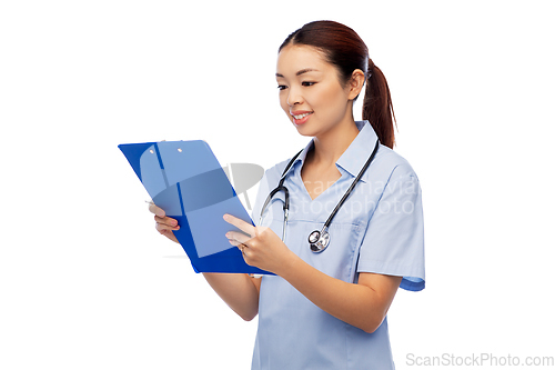 Image of happy smiling asian female doctor with clipboard