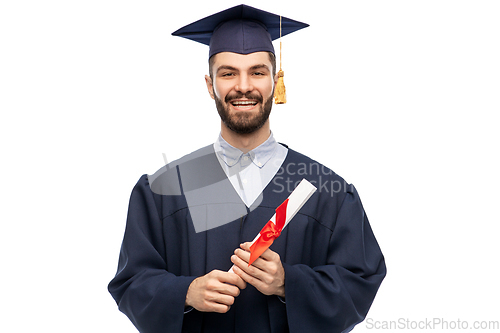 Image of male graduate student in mortar board with diploma