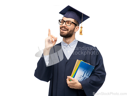 Image of happy graduate student pointing his finger up