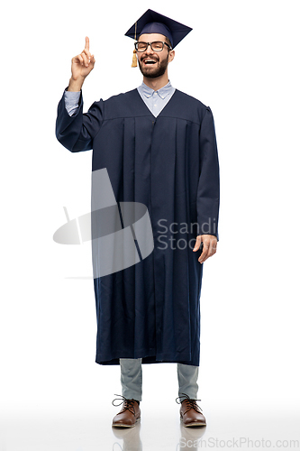 Image of happy graduate student pointing his finger up