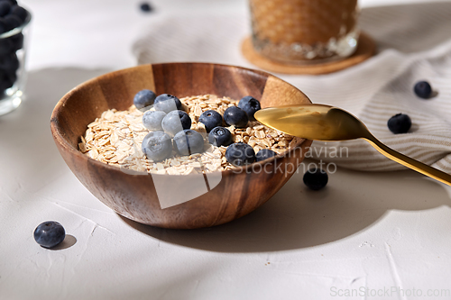 Image of close up of oatmeal in bowl with blueberries