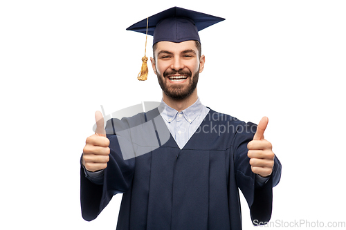 Image of happy male graduate student showing thumbs up
