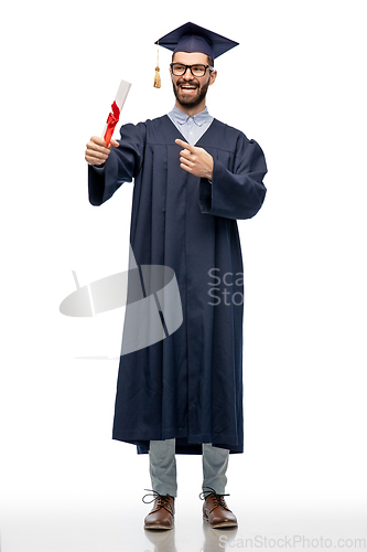 Image of male graduate student in mortar board with diploma