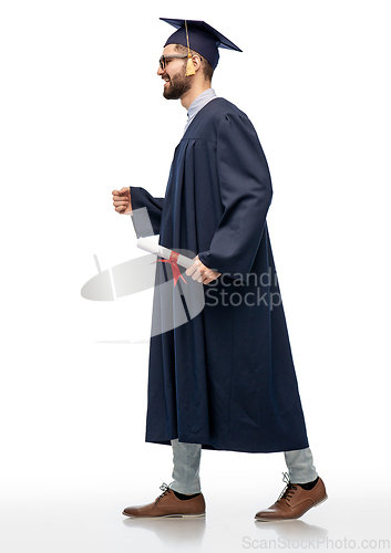 Image of male graduate student in mortar board with diploma