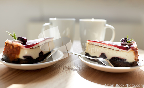 Image of piece of chocolate cake on wooden table