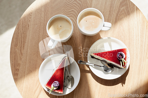 Image of pieces of chocolate cake on wooden table