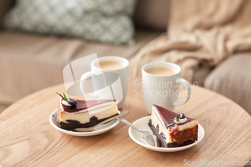 Image of pieces of chocolate cake on wooden table