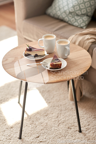 Image of pieces of chocolate cake on wooden table