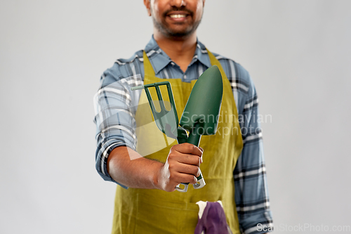 Image of indian gardener or farmer with garden tools