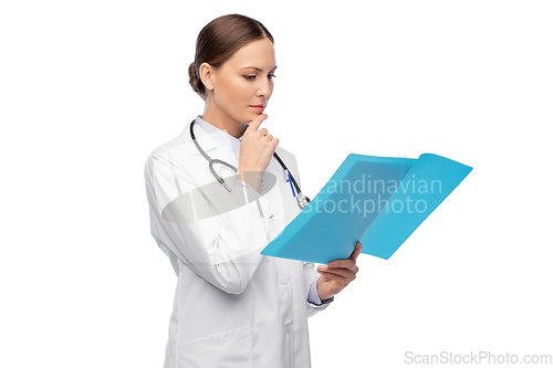 Image of thinking female doctor with folder and stethoscope