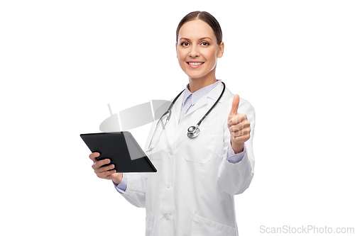 Image of happy female doctor with tablet pc shows thumbs up