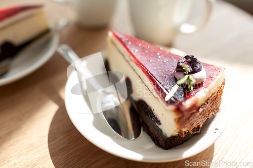 Image of piece of chocolate cake on wooden table