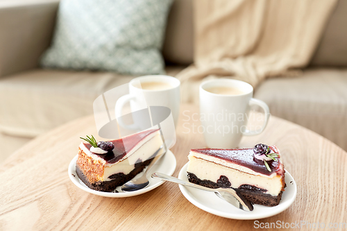 Image of pieces of chocolate cake on wooden table