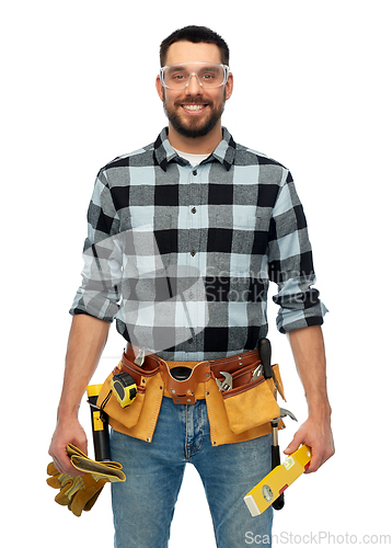 Image of happy male worker or builder with tools and level