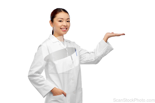 Image of asian female doctor holding something on hand