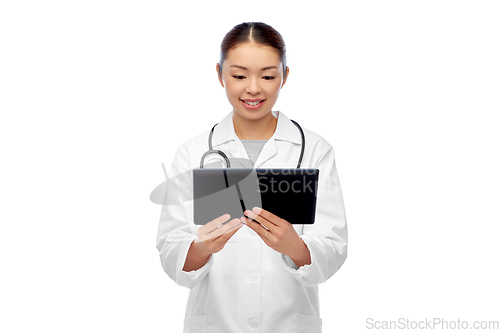 Image of asian female doctor with tablet pc and stethoscope