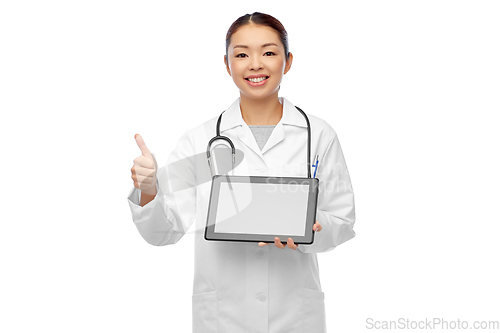 Image of asian female doctor with tablet pc shows thumbs up