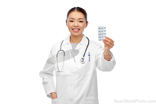 Image of happy asian female doctor or nurse with medicine