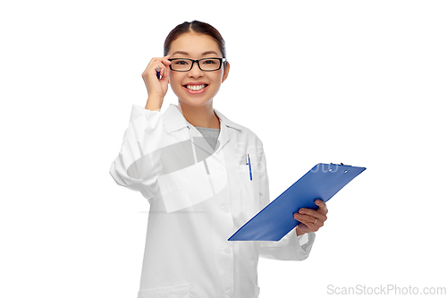 Image of happy smiling asian female doctor with clipboard