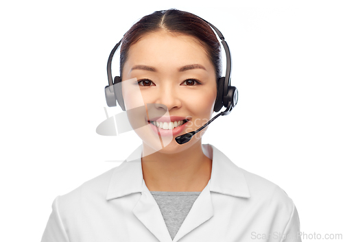 Image of smiling asian female doctor or nurse in headset