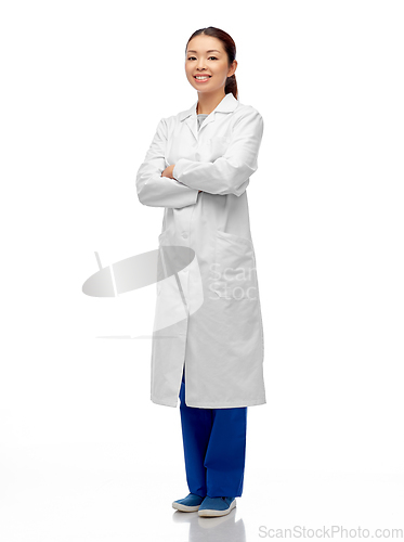 Image of smiling asian female doctor with crossed arms