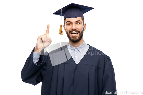 Image of happy graduate student pointing his finger up