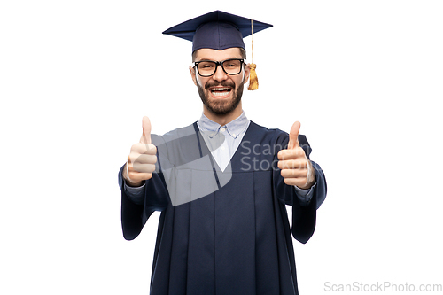 Image of happy male graduate student showing thumbs up