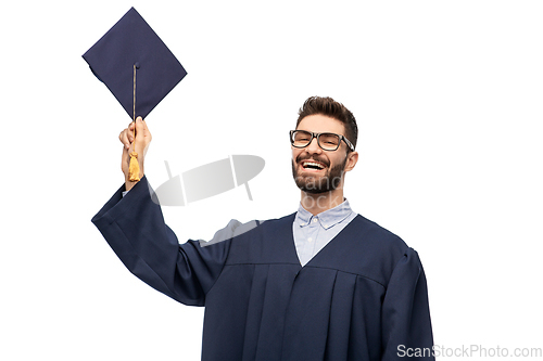 Image of graduate student in bachelor gown with mortarboard