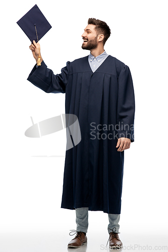 Image of graduate student in bachelor gown with mortarboard