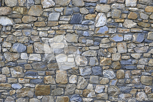 Image of Old wall from stones of various shapes