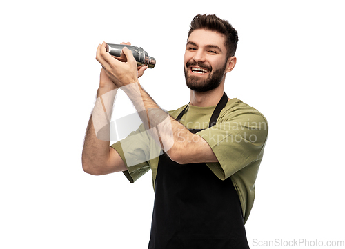 Image of happy barman with shaker preparing